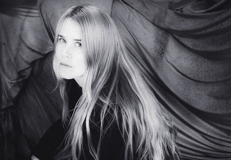 A back and white photo of a woman.