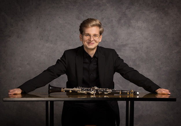 Photo of a man dressed in black.