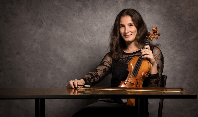 Picture of a woman with glasses and long hair. Photo